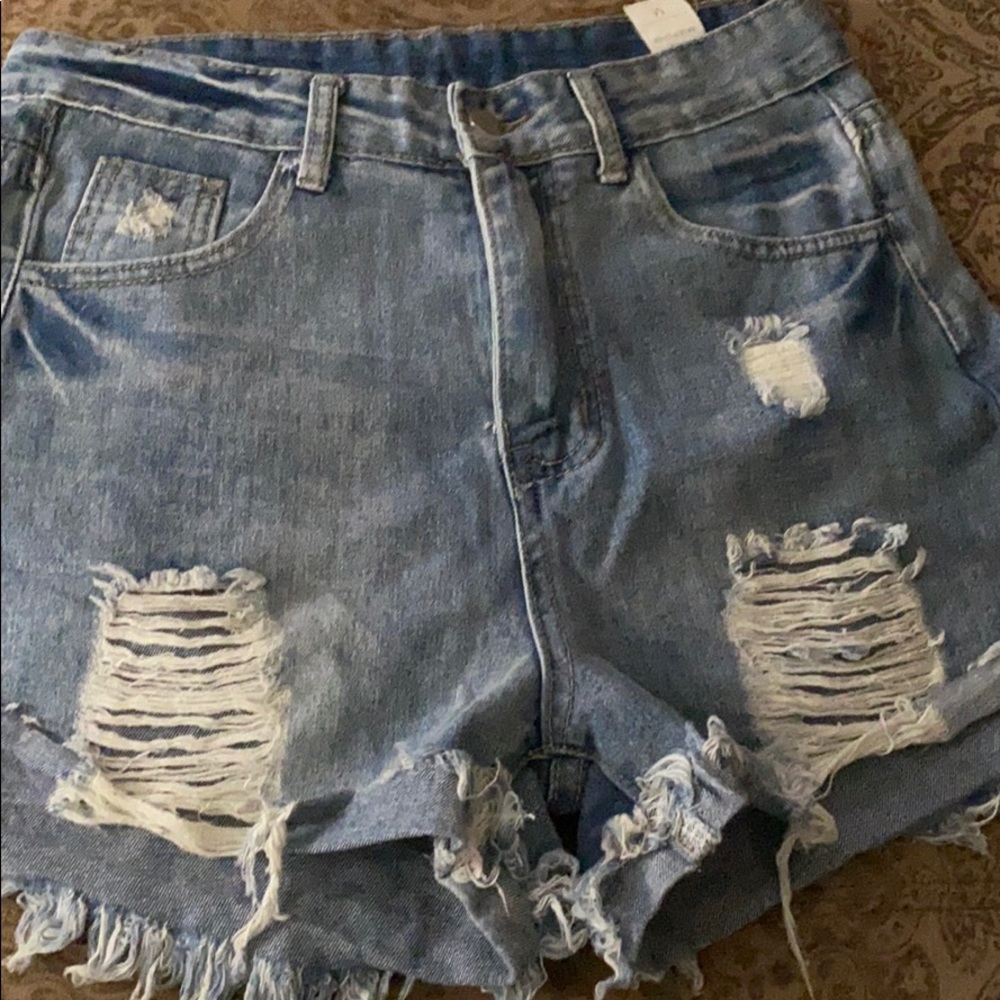 Torn jean shorts